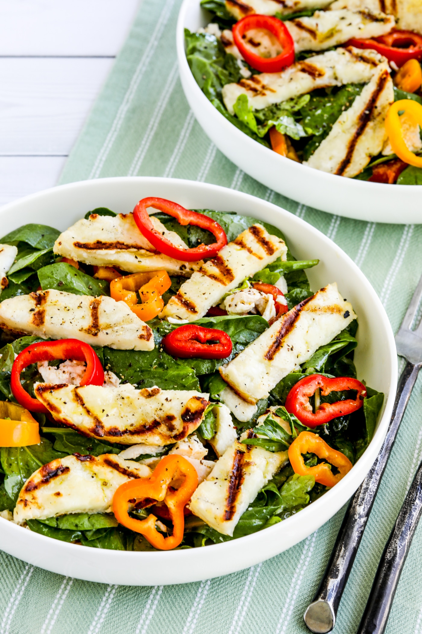 Grilled Halloumi Salad shown in two serving bowls