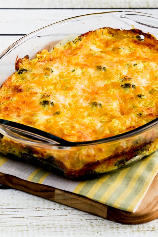 Cheesy Chicken Broccoli Curry Casserole in baking dish shown on cutting board