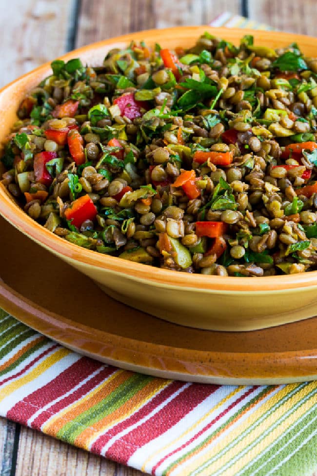 Lentil Salad with Green Olives shown in serving bowl.