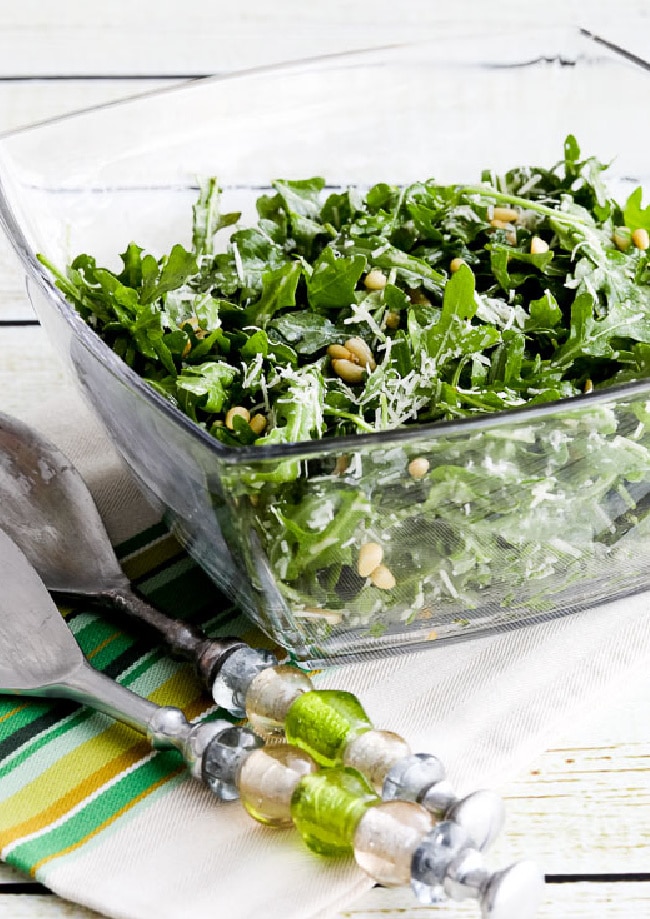 Kalyn's Favorite Baby Arugula Salad shown in salad bowl with serving forks
